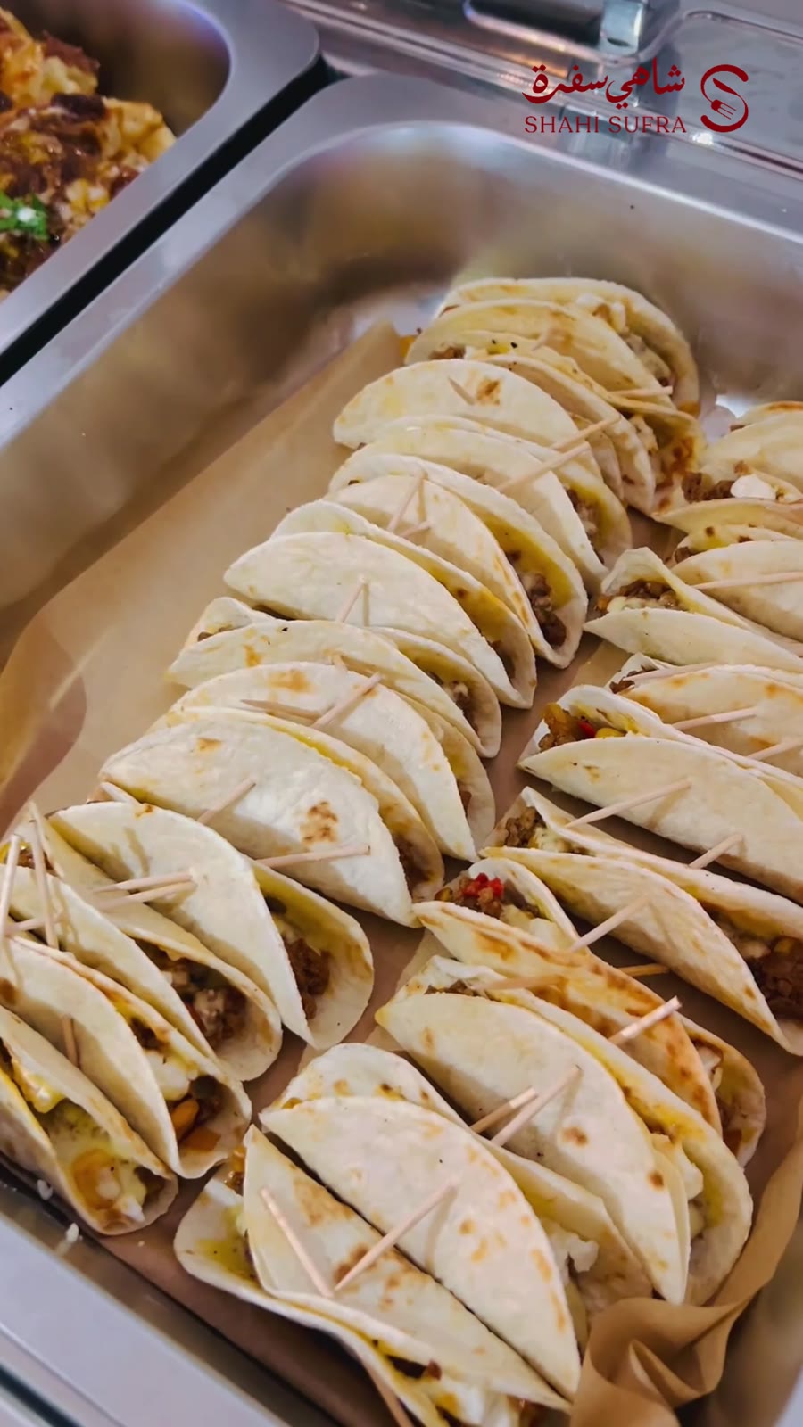 Breakfast wraps arranged in chafing dishes